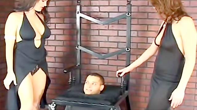 Ladies in sexy dresses facesitting him - Hell Porno